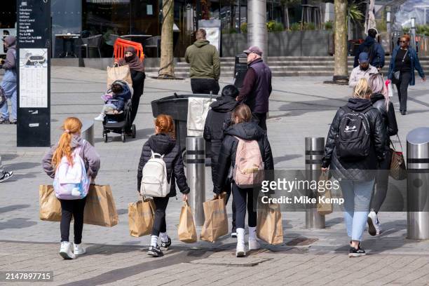 Famils laden with Primark shopping bags in the City Centre Bullring district on 17th April 2024 in Birmingham, United Kingdom. The Birmingham store...