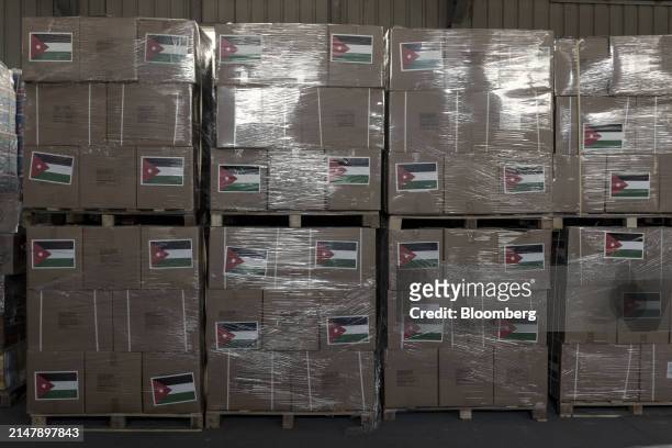 Inside a warehouse of the Jordan Hashemite Charity Organization during an operation of packing and stocking of aid directed to Gaza, in Amman,...