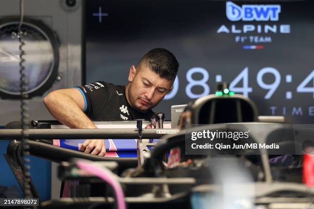 Mechanic works on the Alpine F1 A524 Renault during previews ahead of the F1 Grand Prix of China at Shanghai International Circuit on April 18, 2024...