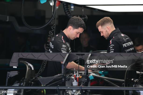 Mechanics work on the Mercedes AMG Petronas F1 Team F1W15 during previews ahead of the F1 Grand Prix of China at Shanghai International Circuit on...