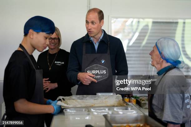 Prince William, Prince of Wales meets workers during a visit to Surplus to Supper, in Sunbury-on-Thames on April 18, 2024 in Surrey, England. The...