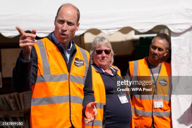 Prince William, Prince of Wales talks to van drivers during a visit to Surplus to Supper, in Sunbury-on-Thames on April 18, 2024 in Surrey, England....