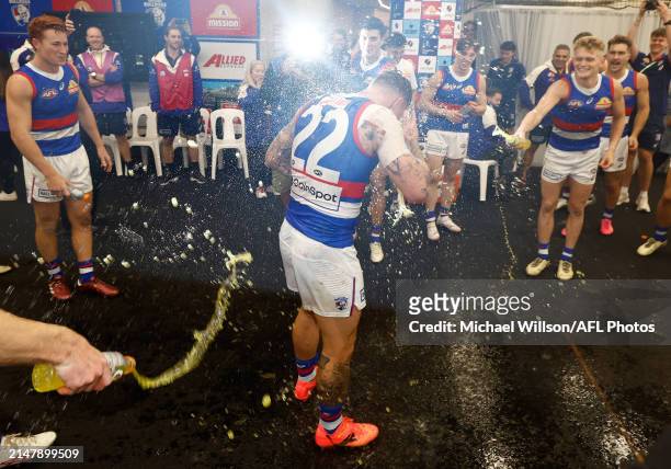 James Harmes of the Bulldogs sings the team song during the 2024 AFL Round 06 match between the St Kilda Saints and the Western Bulldogs at Marvel...