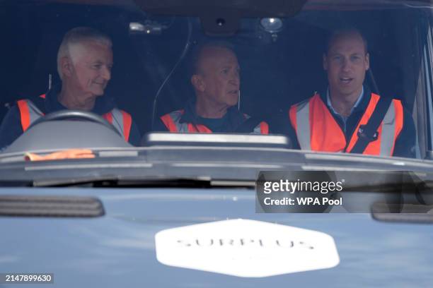 Prince William, Prince of Wales sits in a delivery van during a visit to Surplus to Supper, in Sunbury-on-Thames on April 18, 2024 in Surrey,...