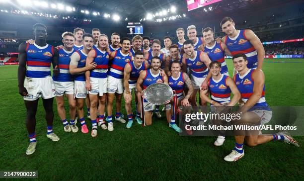 The Bulldogs pose with the Barker-Whitten Challenge Plate after the 2024 AFL Round 06 match between the St Kilda Saints and the Western Bulldogs at...