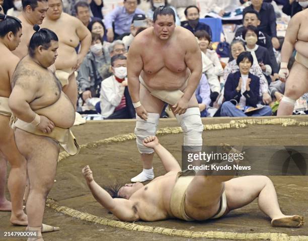 Sumo grand champion Terunofuji takes on Onosato during a spring provincial practice tour in Urayasu in Chiba Prefecture, eastern Japan, on April 18,...
