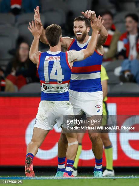 Rhylee West and Marcus Bontempelli of the Bulldogs celebrate during the 2024 AFL Round 06 match between the St Kilda Saints and the Western Bulldogs...
