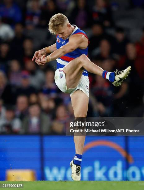 Adam Treloar of the Bulldogs kicks the ball during the 2024 AFL Round 06 match between the St Kilda Saints and the Western Bulldogs at Marvel Stadium...