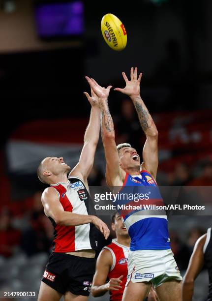 Callum Wilkie of the Saints and Rory Lobb of the Bulldogs compete for the ball during the 2024 AFL Round 06 match between the St Kilda Saints and the...