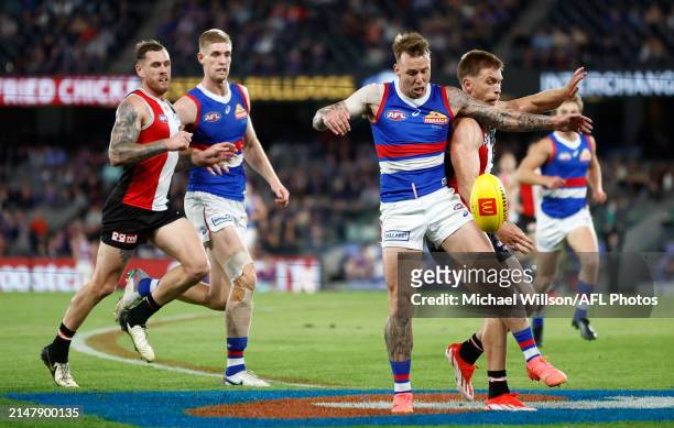 James Harmes of the Bulldogs and Sebastian Ross of the Saints compete for the ball during the 2024 AFL Round 06 match between the St Kilda Saints and...