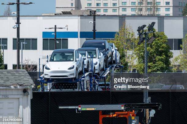 Tesla vehicles on a vehicle transport at the company's assembly plant in Fremont, California, US, on Wednesday, April 17, 2024. Tesla Inc. Is...