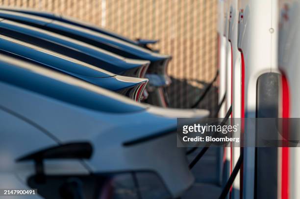 Tesla vehicles at supercharging stations in San Francisco, California, US, on Wednesday, April 17, 2024. Tesla Inc. Is slashing headcount by more...