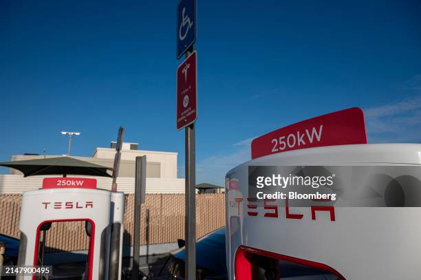 Tesla supercharging stations in San Francisco, California, US, on Wednesday, April 17, 2024. Tesla Inc. Is slashing headcount by more than 10%, part...