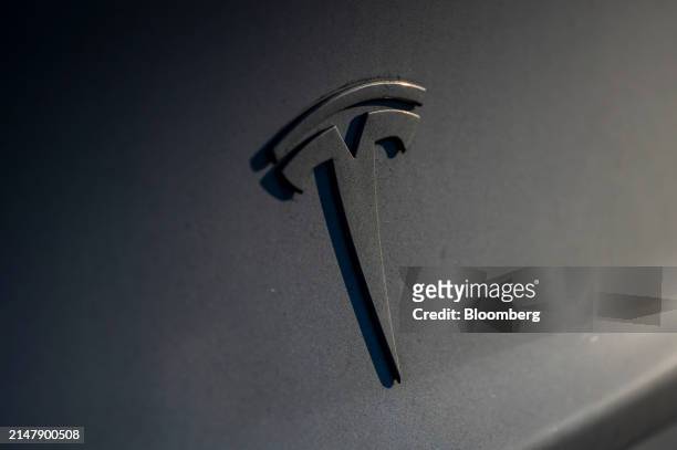 Tesla vehicle at supercharging station in San Francisco, California, US, on Wednesday, April 17, 2024. Tesla Inc. Is slashing headcount by more than...