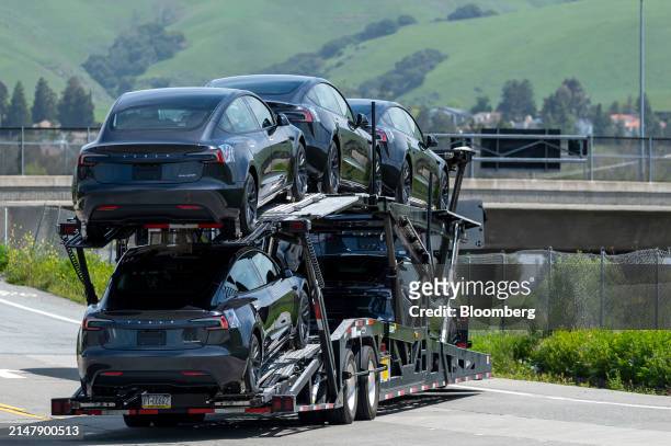 Tesla vehicles on a vehicle transport outside the company's assembly plant in Fremont, California, US, on Wednesday, April 17, 2024. Tesla Inc. Is...