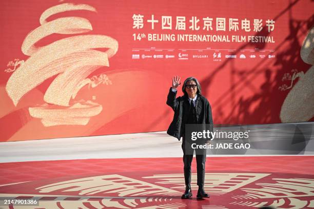 Hong Kong director Peter Ho-Sun Chan arrives on the red carpet during the opening ceremony of the 14th Beijing International Film Festival in...