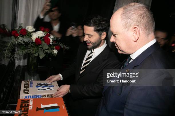 In this handout image provided by Panas Group, Chrysanthos Panas and HSH Prince Albert of Monaco attend the official closing dinner for the Our...