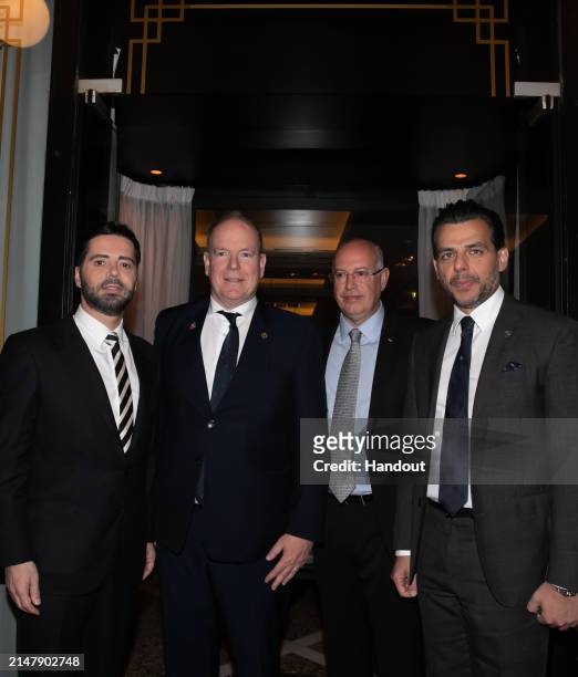 In this handout image provided by Panas Group, Chrysanthos Panas, owner of Panas Group, Prince Albert II of Monaco, Emmanuel Spanoudis from The...