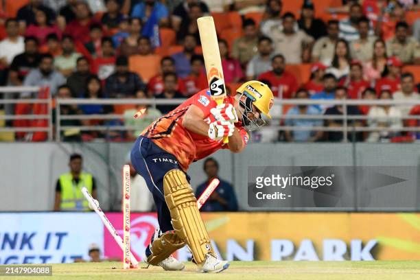 Punjab Kings' Rilee Rossouw is clean bowled by Mumbai Indians' Jasprit Bumrah during the Indian Premier League Twenty20 cricket match between Punjab...