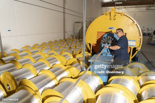 An employee works on the conforming of conductive wires at the TS Conductor Corp. Production facility in Huntington Beach, California, US, on...