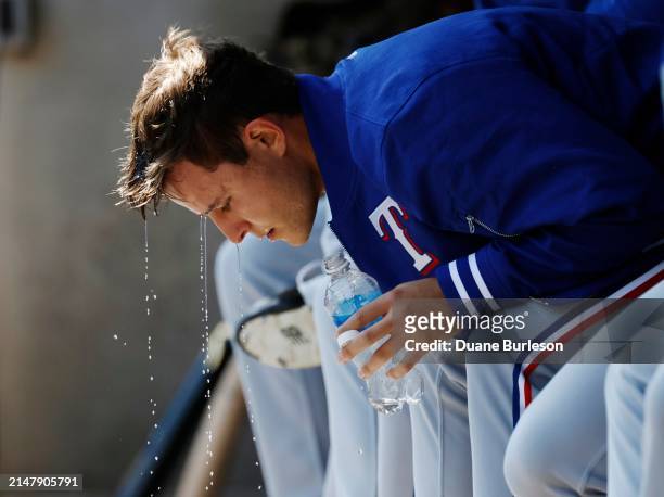 Jack Leiter of the Texas Rangers cools off in the dugout during the first inning of his MLB Debut against the Detroit Tigers at Comerica Park on...