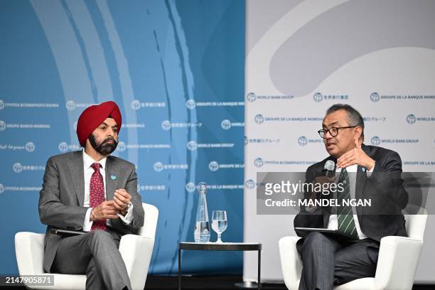 World Health Organization Director-General Tedros Adhanom Ghebreyesus speaks as World Bank President Ajay Banga looks on during an event about...