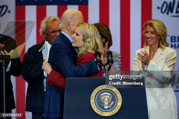 Kerry Kennedy, president of the RFK Center for Justice and Human Rights, center, hugs US President Joe Biden, during a campaign event at the Martin...