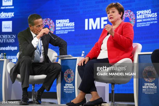 Journalist Richard Quest listens as Managing Director of the IMF Kristalina Georgieva speaks during a "Debate on the Global Economy" during the...