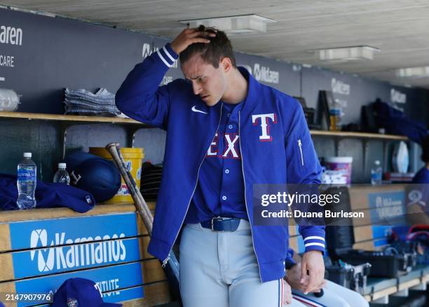 Jack Leiter of the Texas Rangers looks on in the dugout before making his MLB Debut against the Detroit Tigers at Comerica Park on April 18, 2024 in...