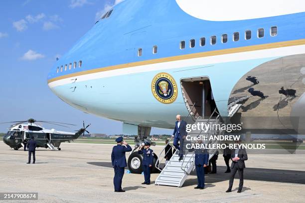 President Joe Biden exits Air Force One as he returns to Joint Base Andrews in Maryland on April 18 after attending campaign events in Philadelphia,...