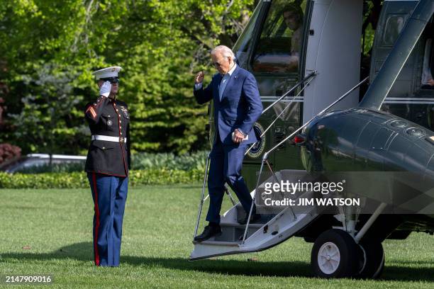 President Joe Biden steps off of Marine One as he arrives on the South Lawn of the White House in Washington, DC, on April 18, 2024. Biden is...