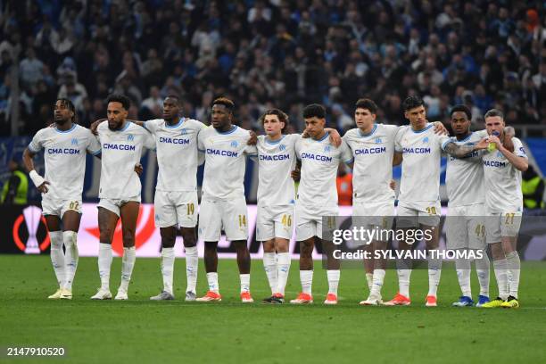Marseille's players stand in line for a penalty shootout during the UEFA Europa League quarter final second leg football match between Olympique de...