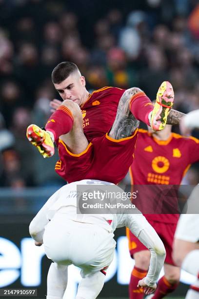 Gianluca Mancini of AS Roma and Olivier Giroud of AC Milan during the UEFA Europa League 2023/24 Quarter-Final second leg match between AS Roma and...