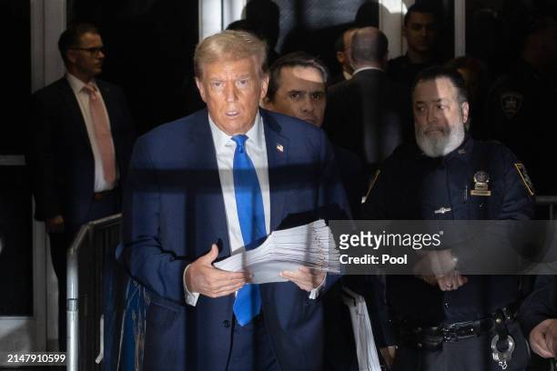 Former U.S. President Donald Trump exits the courtroom following his criminal trial at Manhattan Criminal Court on April 18, 2024 in New York City....