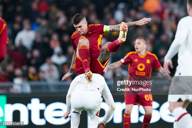 Gianluca Mancini of AS Roma and Olivier Giroud of AC Milan during the UEFA Europa League 2023/24 Quarter-Final second leg match between AS Roma and...