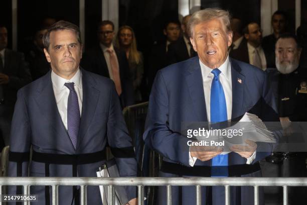 Former U.S. President Donald Trump speaks to members of the media as he departs Manhattan Criminal Court with his attorney Todd Blanche on April 18,...