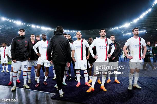 Olivier Giroud of AC Milan and Theo Hernandez of AC Milan and their teammates look dejected at the end of the UEFA Europa League 2023/24...