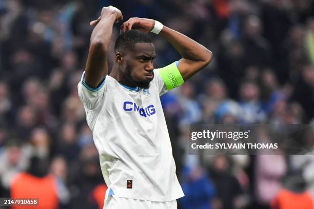 Marseille's French-Central African midfielder Geoffrey Kondogbia celebrates after scoring during the penalty shoot out during the UEFA Europa League...