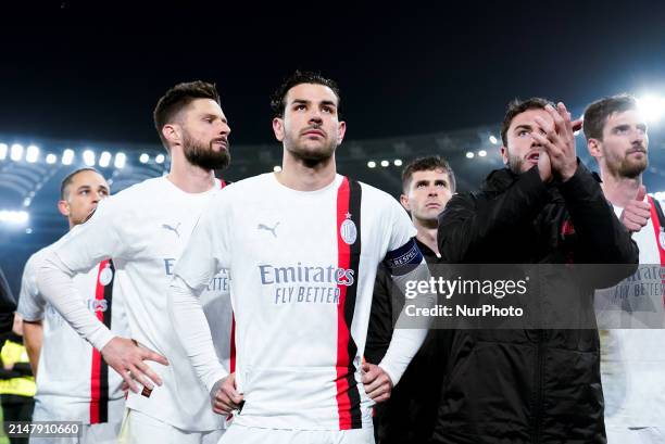 Olivier Giroud of AC Milan and Theo Hernandez of AC Milan and their teammates look dejected at the end of the UEFA Europa League 2023/24...