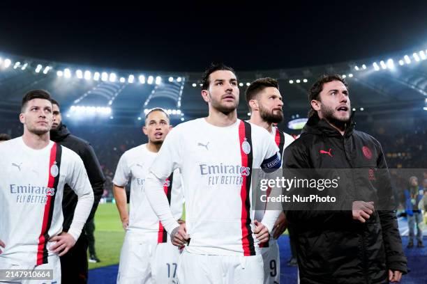 Olivier Giroud of AC Milan and Theo Hernandez of AC Milan and their teammates look dejected at the end of the UEFA Europa League 2023/24...