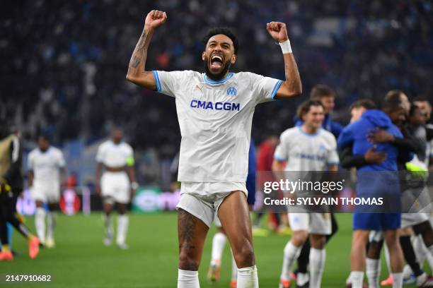 Marseille's French-Gabonese forward Pierre-Emerick Aubameyang celebrates after winning the UEFA Europa League quarter final second leg football match...