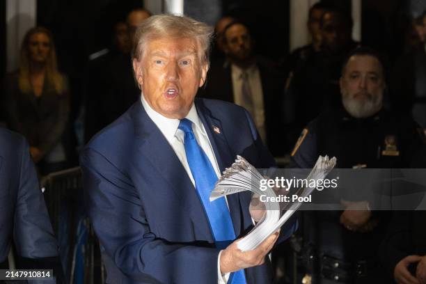 Former U.S. President Donald Trump speaks to members of the media as he departs Manhattan Criminal Court on April 18, 2024 in New York City. On the...