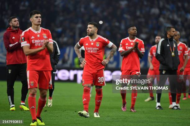 Benfica's Argentinian defender Nicolas Otamendi and teammates react at the end of the UEFA Europa League quarter final second leg football match...