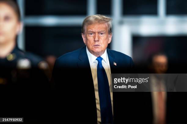 Republican presidential candidate, former President Donald Trump walks out to speak to reporters at the end of the day as jury selection continues at...