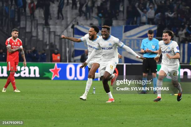 Marseille's French-Gabonese forward Pierre-Emerick Aubameyang, Marseille's Cameroonian forward Faris Moumbagna and Marseille's French midfielder Gael...