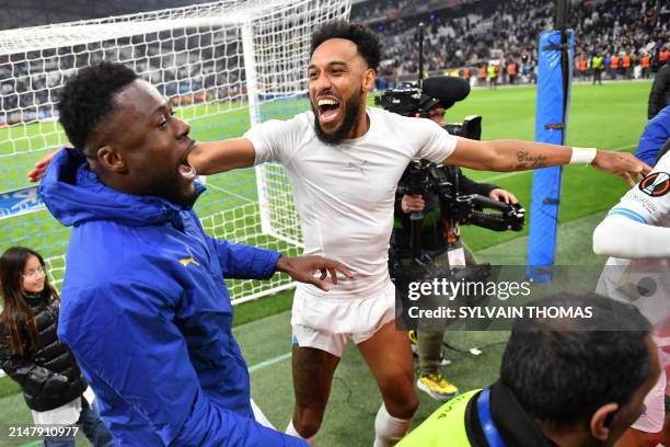 Marseille's French-Gabonese forward Pierre-Emerick Aubameyang celebrates after winning the UEFA Europa League quarter final second leg football match...