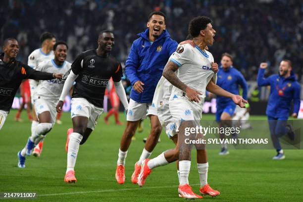 Marseille's Brazilian forward Luis Henrique celebrates with teammates after winning the UEFA Europa League quarter final second leg football match...
