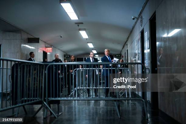 Republican presidential candidate, former President Donald Trump speaks to reporters with attorney Todd Blanche at the end of the day as jury...