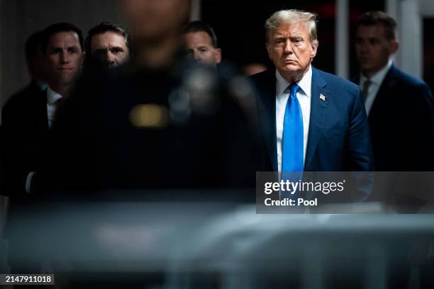 Republican presidential candidate, former President Donald Trump walks out to speak to reporters at the end of the day as jury selection continues at...