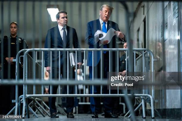 Republican presidential candidate, former President Donald Trump speaks to reporters with attorney Todd Blanche at the end of the day as jury...